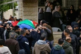 Des personnes portent la dépouille d'Ahmad Al-Shayb, tué la veille lors d'un raid militaire israélien à Burquin en Cisjordanie occupée, le 22 janvier 2025