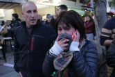 Une femme réagit après avoir été témoin d'une fusillade dans le centre de Tel Aviv, le 1er janvier 2016