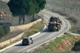 Photo prise depuis le village de Shaqra, dans le sud du Liban, montrant un bulldozer et un 4x4 de l'armée israélienne près de Meiss al-Jabal, à la frontière avec Israël, le 25 janvier 2025