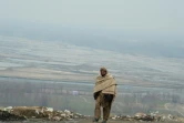 Un afghan traverse la région de Sayad à Mahmood-i-Raqi dans la province de Kapisa, le 23 janvier 2013