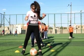 Des petites filles irakiennes participent à une séance d'entraînement au club sportif de Bartalla, à l'est de Mossoul dans la province de Ninive (nord), le 21 octobre 2021