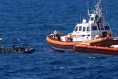 Capture d'image d'une vidéo diffusée par Local Team le 20 août 2019 montrant des migrants secourus par les garde-côtes espagnols après s'être jetés à la mer depuis le bateau humanitaire Open Arms pour rallier l'île de Lampedusa à la nage