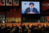 Le chef du Hezbollah libanais Hassan Nasrallah prononçant un discours par vidéoconférence lors d'une réunion du mouvement à Beyrouth le 16 février 2018