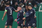 La joie du milieu de terrain de Manchester City Raheem Sterling (2e d), et de ses coéquipiers, après avoir marqué le 5e but contre le Sporting Portugal, lors de leur 8e de finale aller de la Ligue des Champions, le 15 février 2022 à Lisbonne