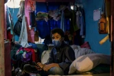Jonathan Figueroa, 14 ans, assis dans une chambre qu'il partage avec sa mère, dans le sous-sol d'un bâtiment d'un ministère à Caracas, le 9 octobre 2020 