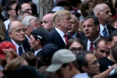 L'ex-maire de New York Rudy Giuliani (g), Donald Trump (c)et le gouverneur du New Jersey Chris Christie (d), lors d'une cérémonie à New York, le 11 septembre 2016