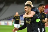 La joie de l'attaquant de l'Ajax Amsterdam, le Serbe Dusan Tadic, après avoir égalisé (1-1) contre Lille,  lors de leur 16e de finale aller de la Ligue Europa, le 18 février 2021 à Villeneuve-d'Ascq 