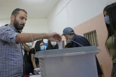 Un électeur vote à Damas pour la présidentielle en Syrie, le 26 mai 2021