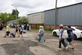 Photo diffusée le 9 août 2024 par le gouvernement de la région de Koursk, en Russie, montrant des enfants évacués de la ville de Rylsk