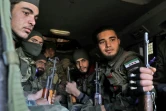 Des combattants syriens soutenus par la Turquie à Qaminas, dans la campagne sud de la province d'Idlib, au nord-ouest de la Syrie le 20 février 2020