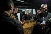 Des clients prennent un verre au bar truck de  Sébastien Cherrier, installé sur la place du village de Villequiers, près de Bourges, le 8 mars 2019