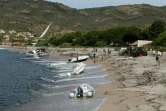 Des bateaux échoués sur la plage de Sagone, le 18 août 2022 à Coggia, après de violents orages en Corse


