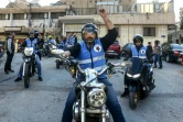 Des membres du club de motards "Hope Bikers Syria" partent distribuer des repas pour l'iftar, pendant le ramadan, le 25 mars 2024 à Damas, en Syrie