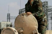 Un soldat syrien sur un tank de l'armée, dans les faubourgs d'Alep, le 04 septembre 2016