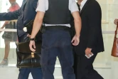 L'ancien numéro deux de Servier Jean-Philippe Seta (D) arrive au tribunal à Paris le 23 septembre 2019