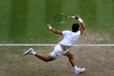 Carlos Alcaraz lors de sa victoire en quart de finale face au Danois Holger Rune le 12 juillet 2023 à Wimbledon. "Je me sens capable de gagner le tournoi", assure le jeune N.1 mondial espagnol 