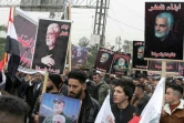 Des partisans du Hachd al-Chaabi, coalition de factions irakiennes pro-Iran, manifestent dans les rues de Bagdad le 1er janvier 2022, pour commémorer le deuxième anniversaire de l'assassinat par les Etats-Unis du général irakien Qassem Soleimani et de son lieutenant irakien