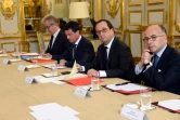 François Hollande entre Manuel Valls et Bernard Cazeneuve le 27 juillet 2016 à l'Elysée à Paris
