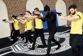 Des élèves débutants apprennent à marcher en manipulant une arme de poing factice au centre de formation Campus Univers Cascade au Cateau-Cambrésis (Nord), le 3 mars 2021