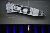 Elon Musk devant une image de sa nouvelle fusée au congrès mondial d'astronautique à Adélaïde le 29 septembre 2017