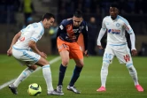 Ryad Boudebouz (c) entre Javier Manquillo et Georges-Kevin Nkoudou, lors du match entre Montpellier et Marseille, le 2 février 2016