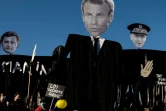 Effigies de Gérarld Darmanin, Emmanuel Macron et du préfet de police Didier Lallement brandies le 28 novembre 2020 lors de la manifestation parisienne contre la loi dite de "sécrutité globale"