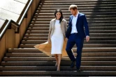 Harry et Meghan descendent les marches de l'opéra de Sydney le 16 octobre 2018