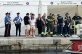 L'attente au port italien de Porticello, en Sicile, le 22 août 2024, où les secouristes ont rapporté les corps de cinq des six personnes portées disparues depuis le naufrage du yacht du magnat britannique Mike Lynch - au nombre des victimes.