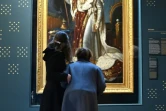 Des visiteuses admirent un "Portrait de Napoléon en costume de sacre" du peintre François Gérard exposée au musée des Marchés de Trajan, le 11 mars 2021 à Rome 