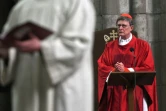 L'archevêque allemand Rainer Maria Woelki prie pendant la messe du Vendredi Saint en la cathédrale de Cologne, le 2 avril 2021