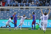 La joie de l'attaquant du Real Madrid, Karim Benzema, après avoir marqué le 2e but face à Barcelone, lors de la demi-finale de la Supercoupe d'Espagne, le 12 janvier 2022 à Riyadh