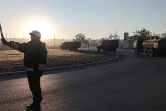 Photo fournie par le ministère russe de la Défense le 16 février 2022 montrant des camions militaires traverser le pont liant la Crimée annexée à la Russie