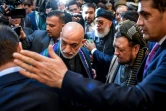 L'ancien président afghan Hamid Karzaï arrive dans un hôtel de Moscou le 5 février 2019, où doit se tenir deux jours de discussions entre talibans et groupes d'opposition