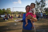 Une migrante avec son enfant dans les bras, partie dans la caravane qui devait se rendre aux Etats-Unis, le 4 avril 2018 au Mexique  