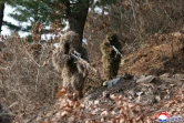 Photo diffusée par l'agence nord-coréenne KCNA, le 5 avril 2025, de soldats nord-coréens à l'entraînement dans un lieu indéterminé, le 4 avril 2025