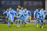 Les joueurs de Trélissac euphoriques après leur qualification pour les 8e de finale de la Coupe de France face à Lille, le 20 janvier 2016 à Périgueux