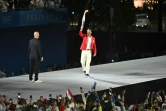 Le footballeur français Zinedine Zidane (g) et le joueur de tennis espagnol Raphael Nadal (d) lors de la cérémonie d'ouverture des Jeux olympiques de Paris, le 26 juillet 2024
