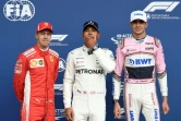 Lewis Hamilton (Mercedes, c) auteur de la pôle position du Grand Prix de Belgique devant l'Allemane Sebastian Vettel (Ferrari, g) et le Français Esteban Ocon (Force India, d) sur le circuit de Spa-Francorchamps, le 25 août 2018   