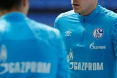 Des joueurs de Schalke à l'échauffement le 15 mai 2021 avant un match de Bundesliga contre l'Eintracht Francfort à Gelsenkirchen