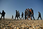 Des migrants sont escortés par le secours en mer britannique à Dungeness, le 7 septembre 2021, dans le sud-est de l'Angleterre
