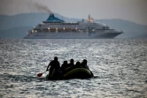 Des migrants arrivent dans une petite embarcation sur l'île de Kos, en Grèce, le 19 août 2015
