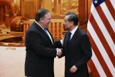 Le secrétaire d'Etat américain Mike Pompeo (g) et son homologue chinois Wang Yi, le 14 juin 2018 au Palais du Peuple, à Pékin