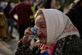 Une femme ayant fui Marioupol arrive à un point d'accueil pour réfugiés à Zaporijjia, le 2 mai 2022