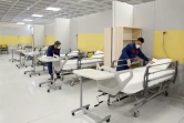 Photo prise le 21 mars 2020 à Téhéran où un immense centre d'exposition dans le plus grand centre commercial d'Iran a été converti en un "centre de santé" censé pouvoir accueillir jusqu'à 3.000 malades du nouveau coronavirus