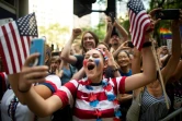 Des supporters de l'équipe de football féminine américaine lors de la parade après leur succès en Coupe du monde, à New York le 10 juillet 2019