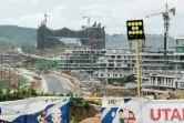 Cette photo prise le 11 juillet 2024 montre des bâtiments en construction, dont le nouveau palais présidentiel (à l'arrière-plan), dans la future capitale indonésienne Nusantara dans la province de  Kalimantan oriental