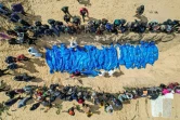 Photo d'archive de 47 corps de Palestiniens pris puis relâchés par Israël lors de funérailles collectives à Rafah, dans le sud de la bande de Gaza, le 7 mars 2024