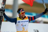 Le Français Benjamin Daviet après la vitoire de la France en relais mixte 4x2.5km lors des jeux paralympiques d'hiver de Pyeongchang le 18 mars 2018