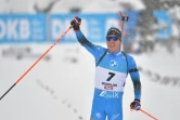La joie du Français Quentin Fillon-Maillet, vainqueur de la poursuite (12,5 km) d'Hochfilzen (Autriche), comptant pour la Coupe du monde de biathlon, le 11 décembre 2021
