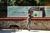 Une affiche invite la population à aller voter à l'élection présidentielle, dans une rue d'Alger, le 5 septembre 2024